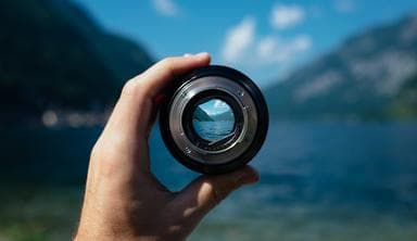 Camera lens showing focused area in the distance