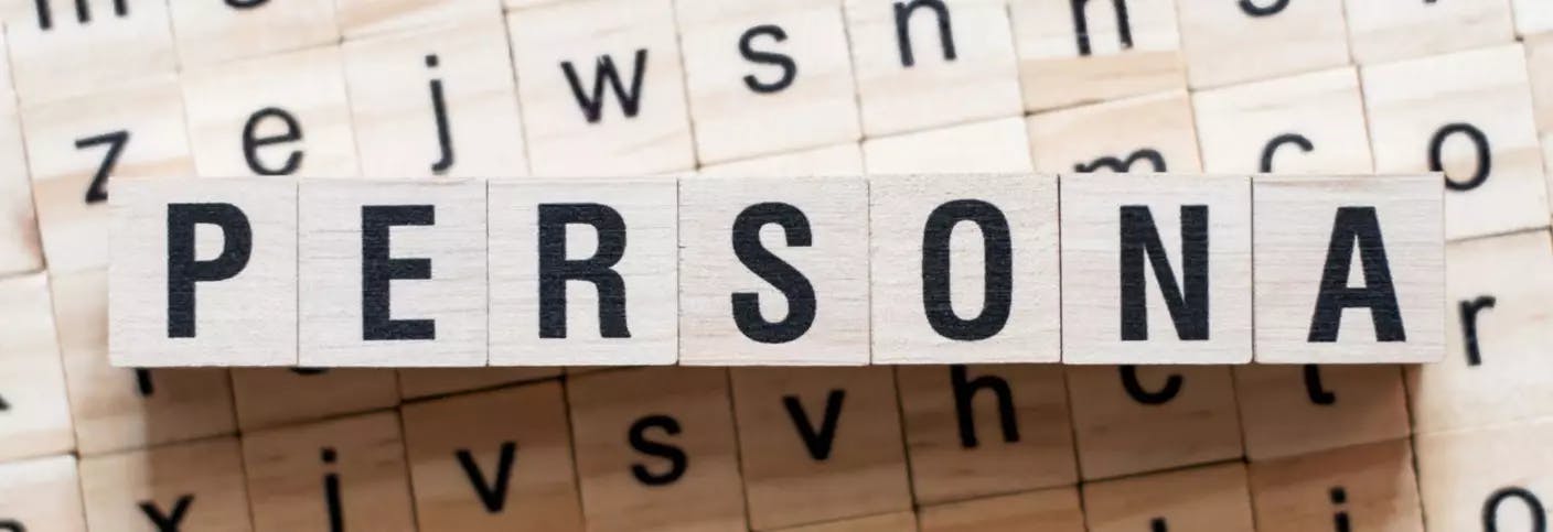 Wooden blocks with letters forming the word "persona". 