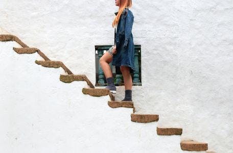 Woman walking up steps